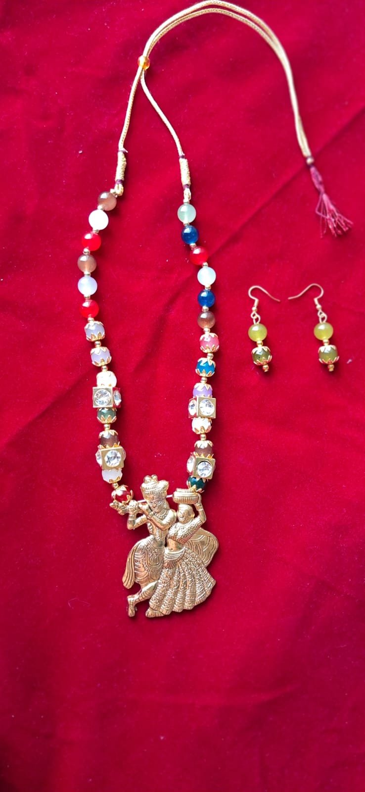 Handcrafted multicolor beaded Radha Krishna necklace set with matching earrings – perfect for traditional and festive wear.