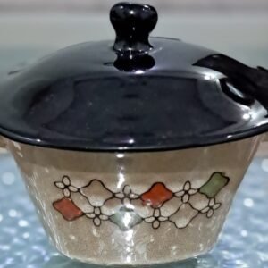 Elegant handcrafted ceramic serving pot set with floral motifs and glossy black lids – perfect for stylish dining.